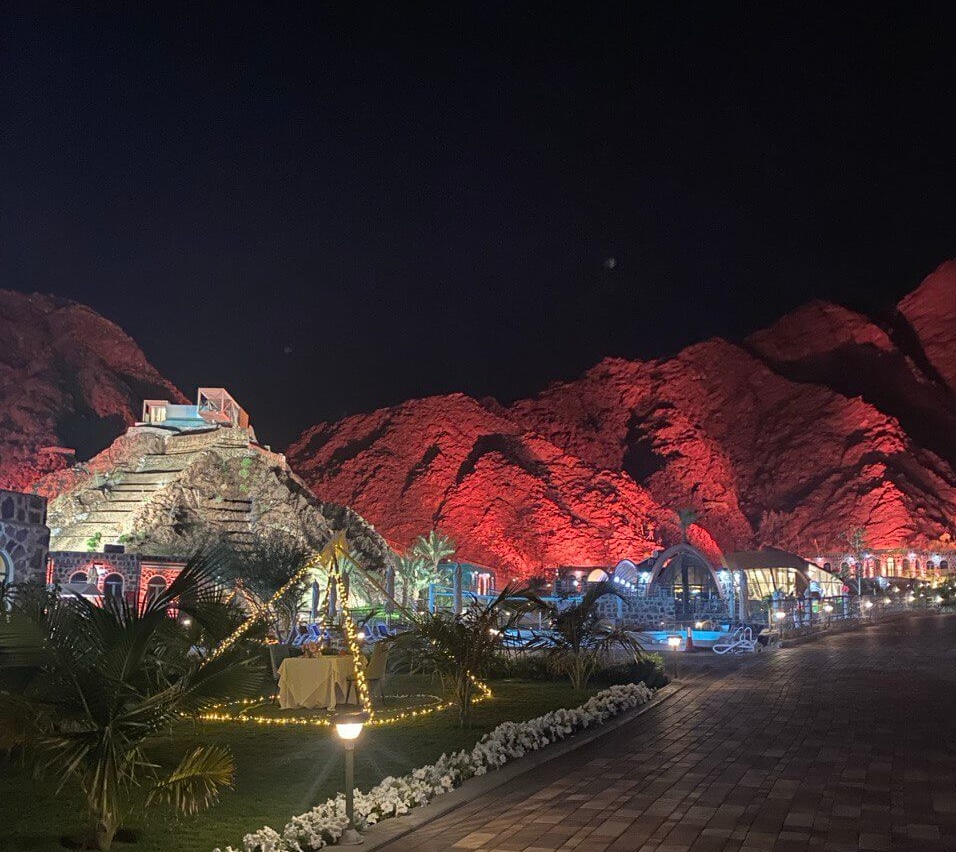 dibba mountain park at night, lit up in red