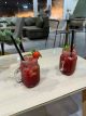 Two strawberry cocktails in mason jar glasses at a Dubai lounge