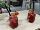Two strawberry cocktails in mason jar glasses at a Dubai lounge