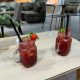 Two strawberry cocktails in mason jar glasses at a Dubai lounge